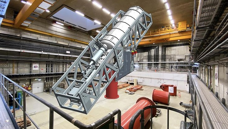 A visualisation of the BabyIAXO experiment in the underground chamber where it will be located.