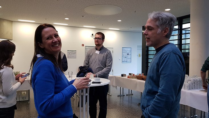 A photograph taken during one of the coffee breaks with Quantum Universe spokesperson Erika Garutti and QURS Director Dieter Horns and other participants.